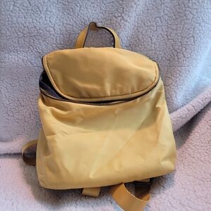 A New Day's yellow polyester Varible Backpack